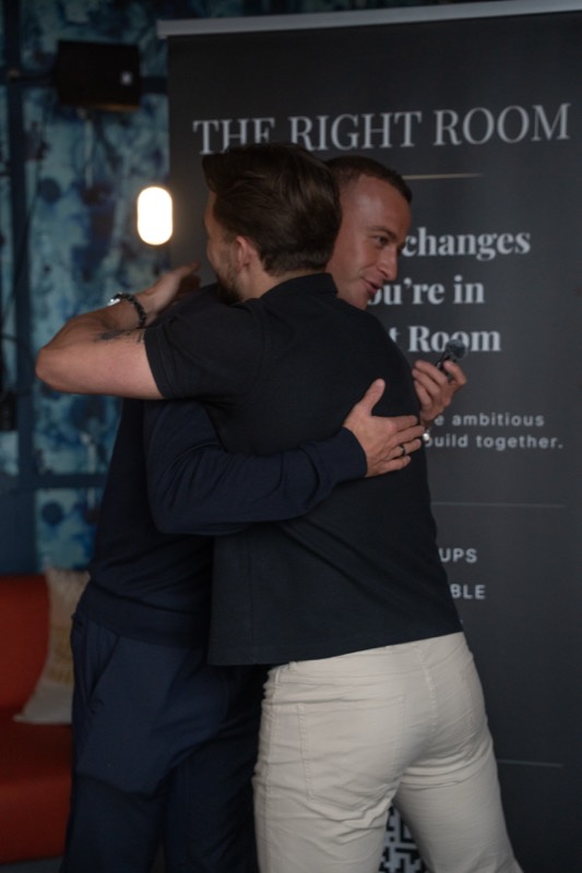 A welcome hug at the banner